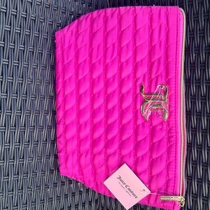 Beautiful pink soft stitched new makeup bag.                12"w  9"h